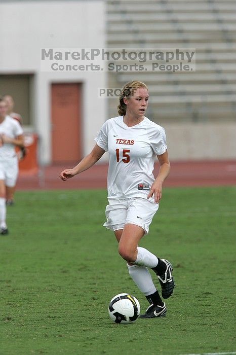 UT freshman Kylie Doniak (#15, Midfielder) crosses the ball in the second half.  The University of Texas women's soccer team won 2-1 against the Iowa State Cyclones Sunday afternoon, October 5, 2008.

Filename: SRM_20081005_13181295.jpg
Aperture: f/5.6
Shutter Speed: 1/1600
Body: Canon EOS-1D Mark II
Lens: Canon EF 300mm f/2.8 L IS