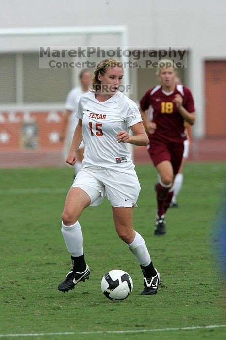 UT freshman Kylie Doniak (#15, Midfielder) crosses the ball in the second half.  The University of Texas women's soccer team won 2-1 against the Iowa State Cyclones Sunday afternoon, October 5, 2008.

Filename: SRM_20081005_13181297.jpg
Aperture: f/5.6
Shutter Speed: 1/1600
Body: Canon EOS-1D Mark II
Lens: Canon EF 300mm f/2.8 L IS