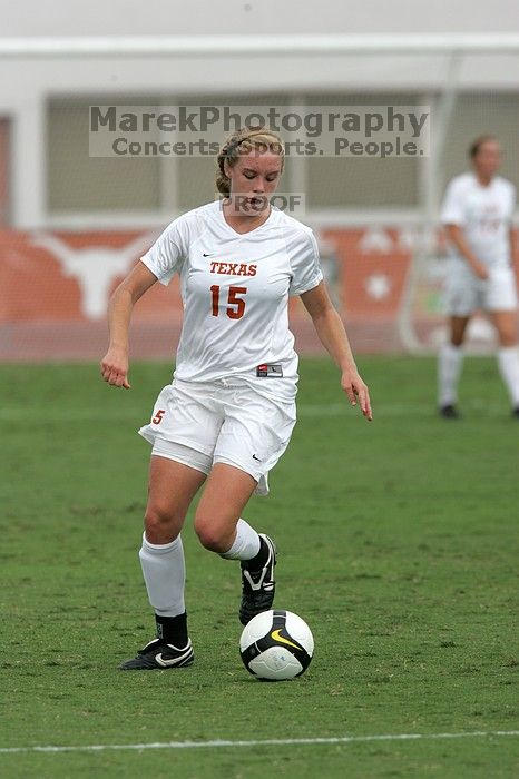 UT freshman Kylie Doniak (#15, Midfielder) crosses the ball in the second half.  The University of Texas women's soccer team won 2-1 against the Iowa State Cyclones Sunday afternoon, October 5, 2008.

Filename: SRM_20081005_13181498.jpg
Aperture: f/5.6
Shutter Speed: 1/2000
Body: Canon EOS-1D Mark II
Lens: Canon EF 300mm f/2.8 L IS