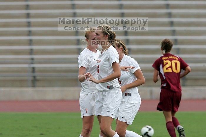 UT freshman Courtney Goodson (#7, Forward and Midfielder) congratulates UT freshman Lucy Keith (#6, Midfielder) on her goal in the second half.  The University of Texas women's soccer team won 2-1 against the Iowa State Cyclones Sunday afternoon, October 5, 2008.

Filename: SRM_20081005_13185807.jpg
Aperture: f/5.6
Shutter Speed: 1/1600
Body: Canon EOS-1D Mark II
Lens: Canon EF 300mm f/2.8 L IS