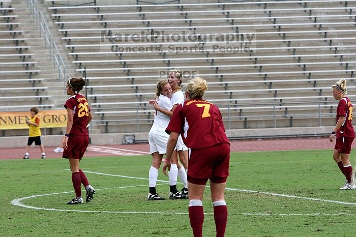 UT freshman Kylie Doniak (#15, Midfielder) congratulates UT freshman Lucy Keith (#6, Midfielder) on her goal in the second half.  The University of Texas women's soccer team won 2-1 against the Iowa State Cyclones Sunday afternoon, October 5, 2008.

Filename: SRM_20081005_13185894.jpg
Aperture: f/5.6
Shutter Speed: 1/1000
Body: Canon EOS 20D
Lens: Canon EF 80-200mm f/2.8 L