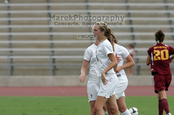 UT freshman Courtney Goodson (#7, Forward and Midfielder) congratulates UT freshman Lucy Keith (#6, Midfielder) on her goal in the second half.  The University of Texas women's soccer team won 2-1 against the Iowa State Cyclones Sunday afternoon, October 5, 2008.

Filename: SRM_20081005_13190008.jpg
Aperture: f/5.6
Shutter Speed: 1/1600
Body: Canon EOS-1D Mark II
Lens: Canon EF 300mm f/2.8 L IS