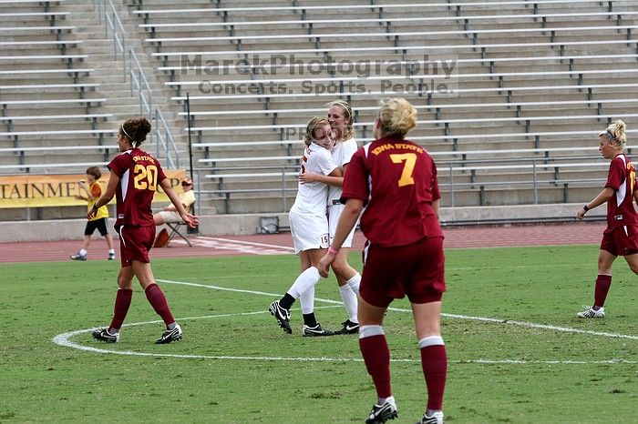 UT freshman Kylie Doniak (#15, Midfielder) congratulates UT freshman Lucy Keith (#6, Midfielder) on her goal in the second half.  The University of Texas women's soccer team won 2-1 against the Iowa State Cyclones Sunday afternoon, October 5, 2008.

Filename: SRM_20081005_13190095.jpg
Aperture: f/5.6
Shutter Speed: 1/1000
Body: Canon EOS 20D
Lens: Canon EF 80-200mm f/2.8 L