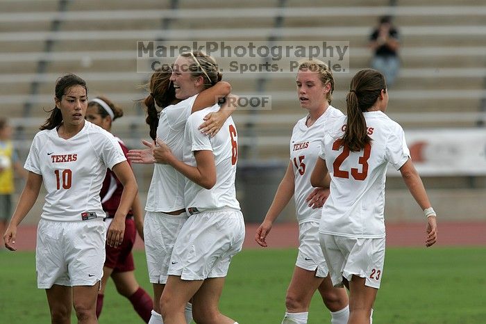 UT sophomore Alisha Ortiz (#12, Forward) congratulates UT freshman Lucy Keith (#6, Midfielder) on her goal in the second half.  The University of Texas women's soccer team won 2-1 against the Iowa State Cyclones Sunday afternoon, October 5, 2008.

Filename: SRM_20081005_13190415.jpg
Aperture: f/5.6
Shutter Speed: 1/2000
Body: Canon EOS-1D Mark II
Lens: Canon EF 300mm f/2.8 L IS