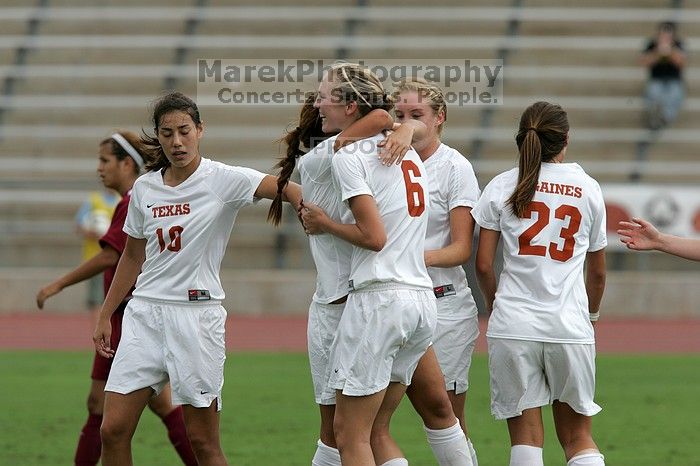 UT sophomore Alisha Ortiz (#12, Forward) congratulates UT freshman Lucy Keith (#6, Midfielder) on her goal in the second half.  The University of Texas women's soccer team won 2-1 against the Iowa State Cyclones Sunday afternoon, October 5, 2008.

Filename: SRM_20081005_13190619.jpg
Aperture: f/5.6
Shutter Speed: 1/2000
Body: Canon EOS-1D Mark II
Lens: Canon EF 300mm f/2.8 L IS