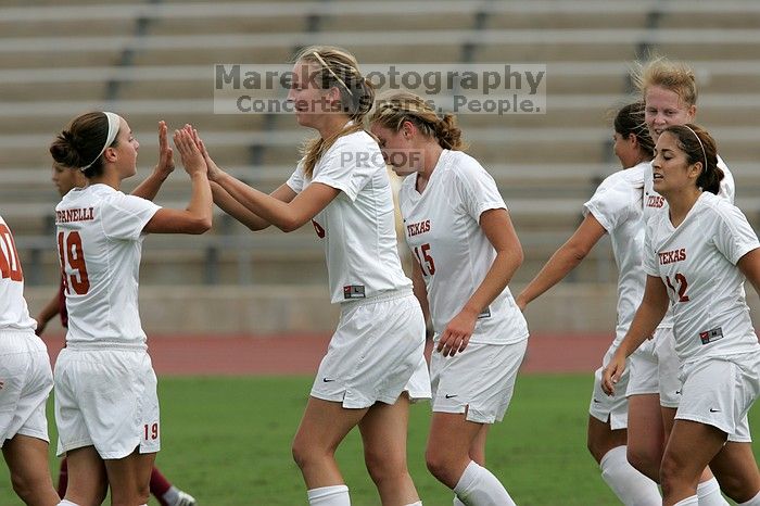 UT sophomore Erica Campanelli (#19, Defender) congratulates UT freshman Lucy Keith (#6, Midfielder) on her goal in the second half.  The University of Texas women's soccer team won 2-1 against the Iowa State Cyclones Sunday afternoon, October 5, 2008.

Filename: SRM_20081005_13190624.jpg
Aperture: f/5.6
Shutter Speed: 1/2000
Body: Canon EOS-1D Mark II
Lens: Canon EF 300mm f/2.8 L IS