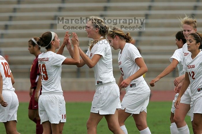 UT sophomore Erica Campanelli (#19, Defender) congratulates UT freshman Lucy Keith (#6, Midfielder) on her goal in the second half.  The University of Texas women's soccer team won 2-1 against the Iowa State Cyclones Sunday afternoon, October 5, 2008.

Filename: SRM_20081005_13190625.jpg
Aperture: f/5.6
Shutter Speed: 1/2000
Body: Canon EOS-1D Mark II
Lens: Canon EF 300mm f/2.8 L IS