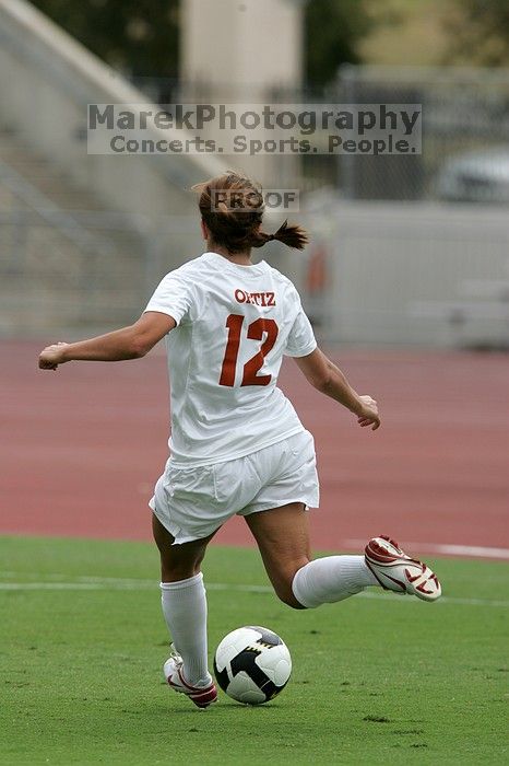 UT sophomore Alisha Ortiz (#12, Forward) in the second half.  The University of Texas women's soccer team won 2-1 against the Iowa State Cyclones Sunday afternoon, October 5, 2008.

Filename: SRM_20081005_13211077.jpg
Aperture: f/5.6
Shutter Speed: 1/2000
Body: Canon EOS-1D Mark II
Lens: Canon EF 300mm f/2.8 L IS