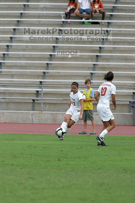 UT freshman Amanda Lisberger (#13, Midfielder) passes the ball to UT senior Stephanie Logterman (#10, Defender) in the second half.  The University of Texas women's soccer team won 2-1 against the Iowa State Cyclones Sunday afternoon, October 5, 2008.

Filename: SRM_20081005_13253082.jpg
Aperture: f/5.6
Shutter Speed: 1/1600
Body: Canon EOS-1D Mark II
Lens: Canon EF 300mm f/2.8 L IS