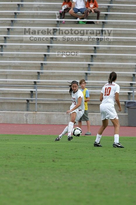 UT freshman Amanda Lisberger (#13, Midfielder) passes the ball to UT senior Stephanie Logterman (#10, Defender) in the second half.  The University of Texas women's soccer team won 2-1 against the Iowa State Cyclones Sunday afternoon, October 5, 2008.

Filename: SRM_20081005_13253083.jpg
Aperture: f/5.6
Shutter Speed: 1/1600
Body: Canon EOS-1D Mark II
Lens: Canon EF 300mm f/2.8 L IS