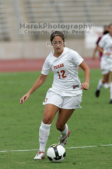 UT sophomore Alisha Ortiz (#12, Forward) in the second half.  The University of Texas women's soccer team won 2-1 against the Iowa State Cyclones Sunday afternoon, October 5, 2008.

Filename: SRM_20081005_13262431.jpg
Aperture: f/5.6
Shutter Speed: 1/1600
Body: Canon EOS-1D Mark II
Lens: Canon EF 300mm f/2.8 L IS