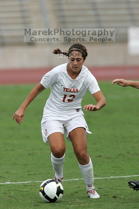 UT sophomore Alisha Ortiz (#12, Forward) in the second half.  The University of Texas women's soccer team won 2-1 against the Iowa State Cyclones Sunday afternoon, October 5, 2008.

Filename: SRM_20081005_13262433.jpg
Aperture: f/5.6
Shutter Speed: 1/1600
Body: Canon EOS-1D Mark II
Lens: Canon EF 300mm f/2.8 L IS