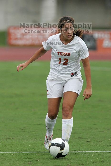 UT sophomore Alisha Ortiz (#12, Forward) in the second half.  The University of Texas women's soccer team won 2-1 against the Iowa State Cyclones Sunday afternoon, October 5, 2008.

Filename: SRM_20081005_13280470.jpg
Aperture: f/5.6
Shutter Speed: 1/1600
Body: Canon EOS-1D Mark II
Lens: Canon EF 300mm f/2.8 L IS