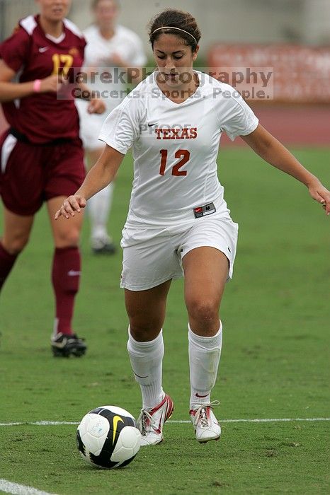 UT sophomore Alisha Ortiz (#12, Forward) in the second half.  The University of Texas women's soccer team won 2-1 against the Iowa State Cyclones Sunday afternoon, October 5, 2008.

Filename: SRM_20081005_13280675.jpg
Aperture: f/5.6
Shutter Speed: 1/1600
Body: Canon EOS-1D Mark II
Lens: Canon EF 300mm f/2.8 L IS