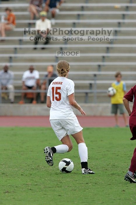 UT freshman Kylie Doniak (#15, Midfielder) in the second half.  The University of Texas women's soccer team won 2-1 against the Iowa State Cyclones Sunday afternoon, October 5, 2008.

Filename: SRM_20081005_13292208.jpg
Aperture: f/5.6
Shutter Speed: 1/1250
Body: Canon EOS-1D Mark II
Lens: Canon EF 300mm f/2.8 L IS