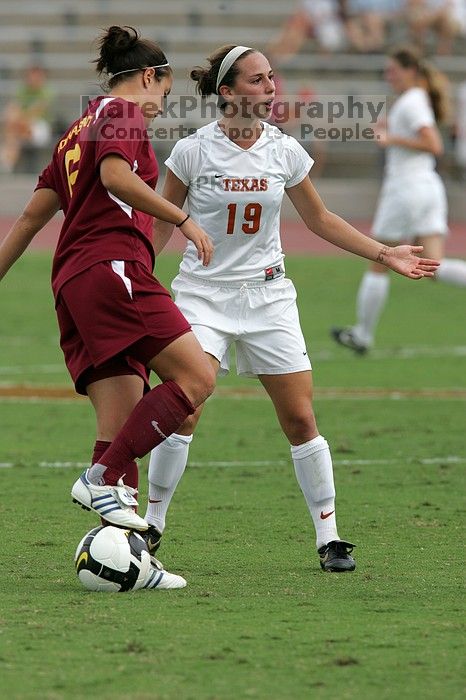 UT sophomore Erica Campanelli (#19, Defender) argues with a referee about a foul in the second half.  The University of Texas women's soccer team won 2-1 against the Iowa State Cyclones Sunday afternoon, October 5, 2008.

Filename: SRM_20081005_13312231.jpg
Aperture: f/5.6
Shutter Speed: 1/1600
Body: Canon EOS-1D Mark II
Lens: Canon EF 300mm f/2.8 L IS