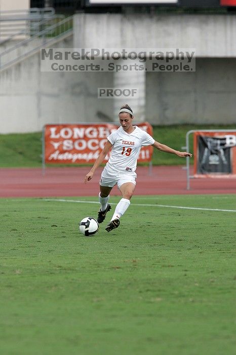 UT sophomore Erica Campanelli (#19, Defender) crosses the ball in the second half.  The University of Texas women's soccer team won 2-1 against the Iowa State Cyclones Sunday afternoon, October 5, 2008.

Filename: SRM_20081005_13314635.jpg
Aperture: f/5.6
Shutter Speed: 1/1600
Body: Canon EOS-1D Mark II
Lens: Canon EF 300mm f/2.8 L IS