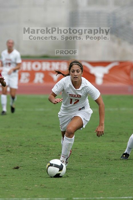 UT sophomore Alisha Ortiz (#12, Forward) in the second half.  The University of Texas women's soccer team won 2-1 against the Iowa State Cyclones Sunday afternoon, October 5, 2008.

Filename: SRM_20081005_13330052.jpg
Aperture: f/5.6
Shutter Speed: 1/1600
Body: Canon EOS-1D Mark II
Lens: Canon EF 300mm f/2.8 L IS