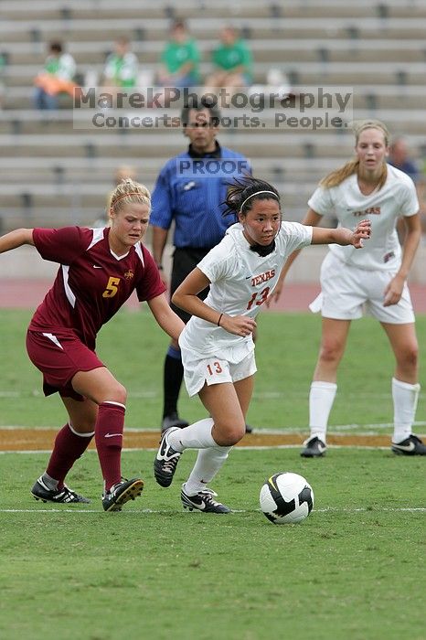 UT freshman Amanda Lisberger (#13, Midfielder) steals the ball as UT freshman Lucy Keith (#6, Midfielder) watches in the second half.  The University of Texas women's soccer team won 2-1 against the Iowa State Cyclones Sunday afternoon, October 5, 2008.

Filename: SRM_20081005_13335870.jpg
Aperture: f/5.6
Shutter Speed: 1/1000
Body: Canon EOS-1D Mark II
Lens: Canon EF 300mm f/2.8 L IS