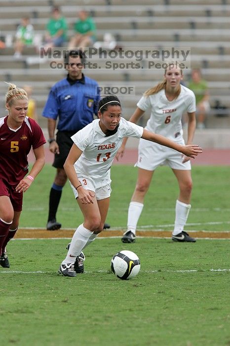 UT freshman Amanda Lisberger (#13, Midfielder) steals the ball as UT freshman Lucy Keith (#6, Midfielder) watches in the second half.  The University of Texas women's soccer team won 2-1 against the Iowa State Cyclones Sunday afternoon, October 5, 2008.

Filename: SRM_20081005_13335871.jpg
Aperture: f/5.6
Shutter Speed: 1/1250
Body: Canon EOS-1D Mark II
Lens: Canon EF 300mm f/2.8 L IS