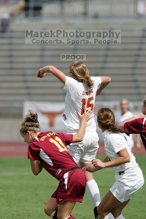 UT freshman Kylie Doniak (#15, Midfielder) with the header in the second half.  The University of Texas women's soccer team won 2-1 against the Iowa State Cyclones Sunday afternoon, October 5, 2008.

Filename: SRM_20081005_13412047.jpg
Aperture: f/5.6
Shutter Speed: 1/2500
Body: Canon EOS-1D Mark II
Lens: Canon EF 300mm f/2.8 L IS