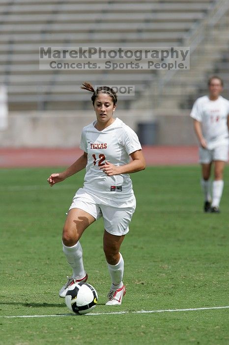 UT sophomore Alisha Ortiz (#12, Forward) in the second half.  The University of Texas women's soccer team won 2-1 against the Iowa State Cyclones Sunday afternoon, October 5, 2008.

Filename: SRM_20081005_13424667.jpg
Aperture: f/5.6
Shutter Speed: 1/2500
Body: Canon EOS-1D Mark II
Lens: Canon EF 300mm f/2.8 L IS