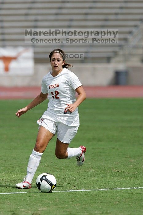 UT sophomore Alisha Ortiz (#12, Forward) in the second half.  The University of Texas women's soccer team won 2-1 against the Iowa State Cyclones Sunday afternoon, October 5, 2008.

Filename: SRM_20081005_13424668.jpg
Aperture: f/5.6
Shutter Speed: 1/2500
Body: Canon EOS-1D Mark II
Lens: Canon EF 300mm f/2.8 L IS