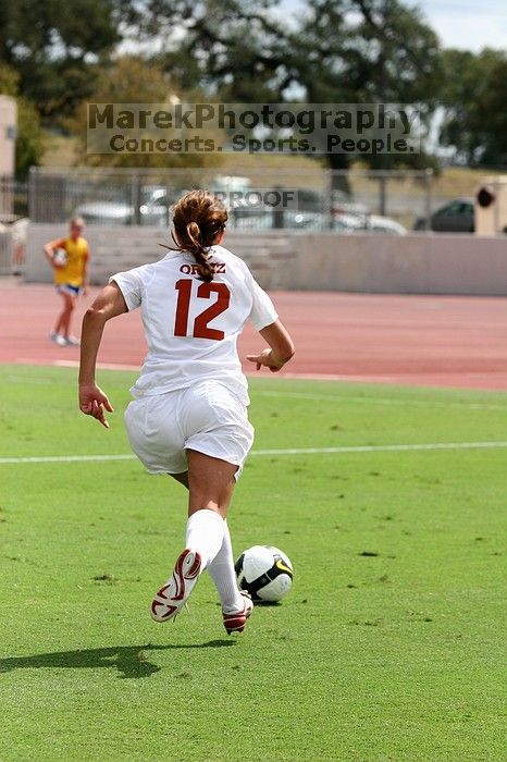 UT sophomore Alisha Ortiz (#12, Forward) in the second half.  The University of Texas women's soccer team won 2-1 against the Iowa State Cyclones Sunday afternoon, October 5, 2008.

Filename: SRM_20081005_13425619.jpg
Aperture: f/5.0
Shutter Speed: 1/3200
Body: Canon EOS 20D
Lens: Canon EF 80-200mm f/2.8 L