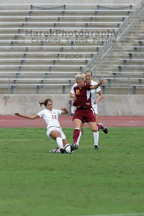 UT sophomore Alisha Ortiz (#12, Forward) slide tackles in the second half.  The University of Texas women's soccer team won 2-1 against the Iowa State Cyclones Sunday afternoon, October 5, 2008.

Filename: SRM_20081005_13441677.jpg
Aperture: f/5.6
Shutter Speed: 1/1600
Body: Canon EOS-1D Mark II
Lens: Canon EF 300mm f/2.8 L IS