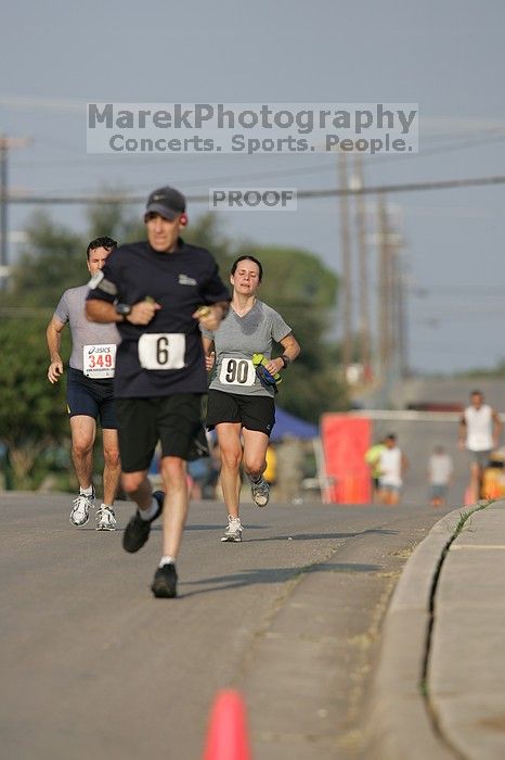 Beth Marek won first place in her age division at the Army Dillo half-marathon and 32K race.

Filename: SRM_20080921_0841309.jpg
Aperture: f/4.0
Shutter Speed: 1/2000
Body: Canon EOS-1D Mark II
Lens: Canon EF 300mm f/2.8 L IS