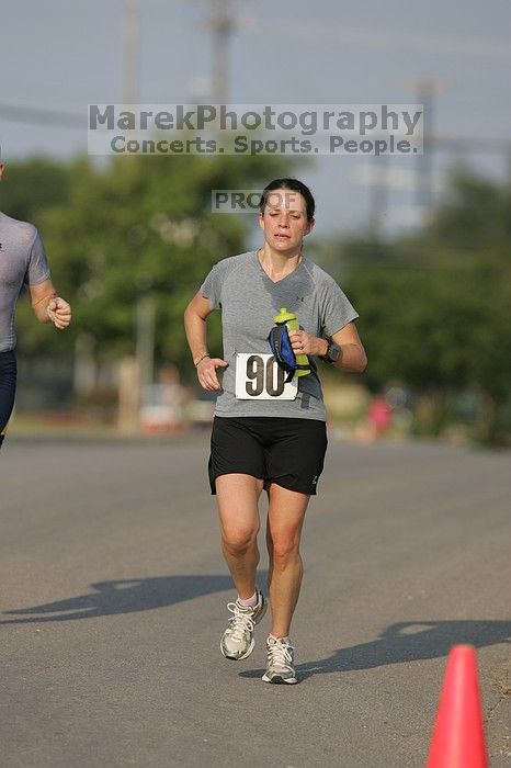 Beth Marek won first place in her age division at the Army Dillo half-marathon and 32K race.

Filename: SRM_20080921_0841361.jpg
Aperture: f/4.0
Shutter Speed: 1/2000
Body: Canon EOS-1D Mark II
Lens: Canon EF 300mm f/2.8 L IS