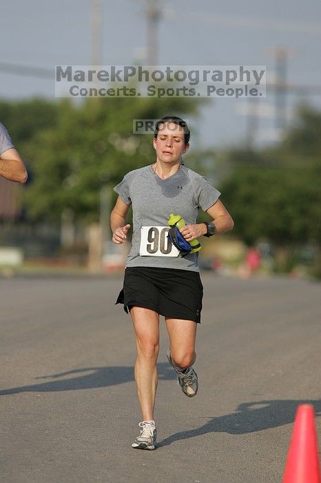 Beth Marek won first place in her age division at the Army Dillo half-marathon and 32K race.

Filename: SRM_20080921_0841363.jpg
Aperture: f/4.0
Shutter Speed: 1/2000
Body: Canon EOS-1D Mark II
Lens: Canon EF 300mm f/2.8 L IS