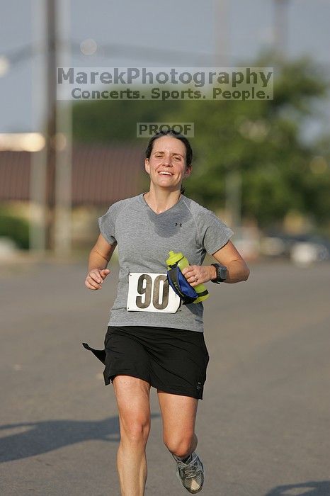 Beth Marek won first place in her age division at the Army Dillo half-marathon and 32K race.

Filename: SRM_20080921_0841365.jpg
Aperture: f/4.0
Shutter Speed: 1/2000
Body: Canon EOS-1D Mark II
Lens: Canon EF 300mm f/2.8 L IS