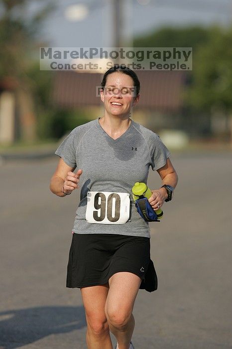 Beth Marek won first place in her age division at the Army Dillo half-marathon and 32K race.

Filename: SRM_20080921_0841389.jpg
Aperture: f/4.0
Shutter Speed: 1/2000
Body: Canon EOS-1D Mark II
Lens: Canon EF 300mm f/2.8 L IS