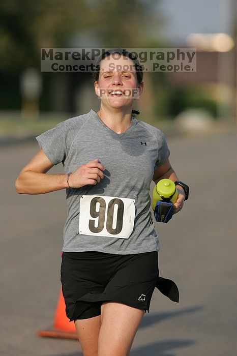 Beth Marek won first place in her age division at the Army Dillo half-marathon and 32K race.

Filename: SRM_20080921_0841405.jpg
Aperture: f/4.0
Shutter Speed: 1/2000
Body: Canon EOS-1D Mark II
Lens: Canon EF 300mm f/2.8 L IS