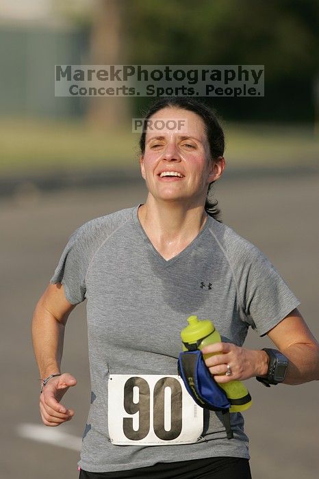 Beth Marek won first place in her age division at the Army Dillo half-marathon and 32K race.

Filename: SRM_20080921_0841422.jpg
Aperture: f/4.0
Shutter Speed: 1/2000
Body: Canon EOS-1D Mark II
Lens: Canon EF 300mm f/2.8 L IS