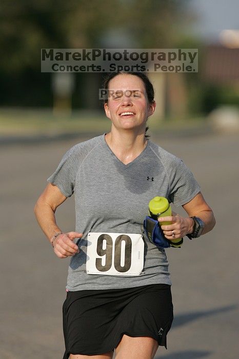 Beth Marek won first place in her age division at the Army Dillo half-marathon and 32K race.

Filename: SRM_20080921_0841426.jpg
Aperture: f/4.0
Shutter Speed: 1/2000
Body: Canon EOS-1D Mark II
Lens: Canon EF 300mm f/2.8 L IS