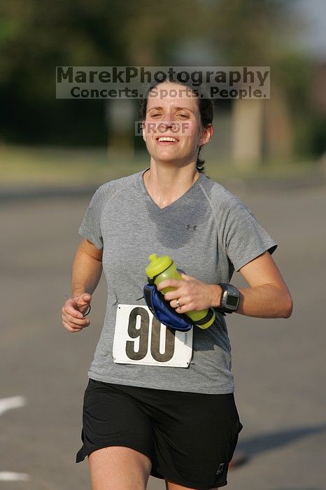 Beth Marek won first place in her age division at the Army Dillo half-marathon and 32K race.

Filename: SRM_20080921_0841427.jpg
Aperture: f/4.0
Shutter Speed: 1/2000
Body: Canon EOS-1D Mark II
Lens: Canon EF 300mm f/2.8 L IS