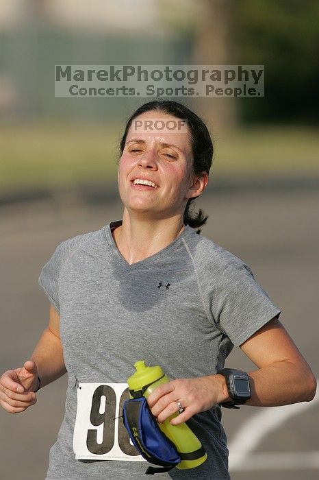 Beth Marek won first place in her age division at the Army Dillo half-marathon and 32K race.

Filename: SRM_20080921_0841444.jpg
Aperture: f/4.0
Shutter Speed: 1/2000
Body: Canon EOS-1D Mark II
Lens: Canon EF 300mm f/2.8 L IS