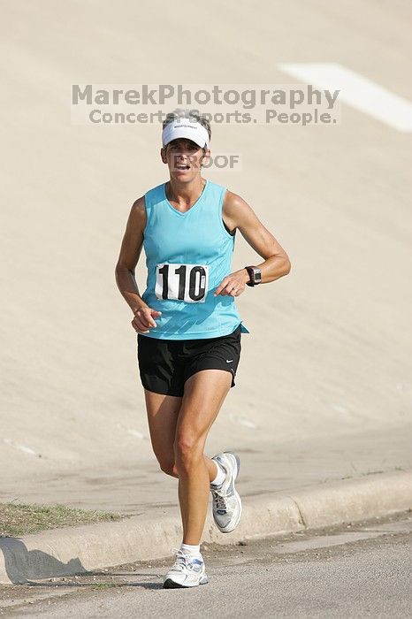 Karen Pearce placed second in her age groun at the Army Dillo half-marathon and 32K race.

Filename: SRM_20080921_0943548.jpg
Aperture: f/4.0
Shutter Speed: 1/2000
Body: Canon EOS-1D Mark II
Lens: Canon EF 300mm f/2.8 L IS