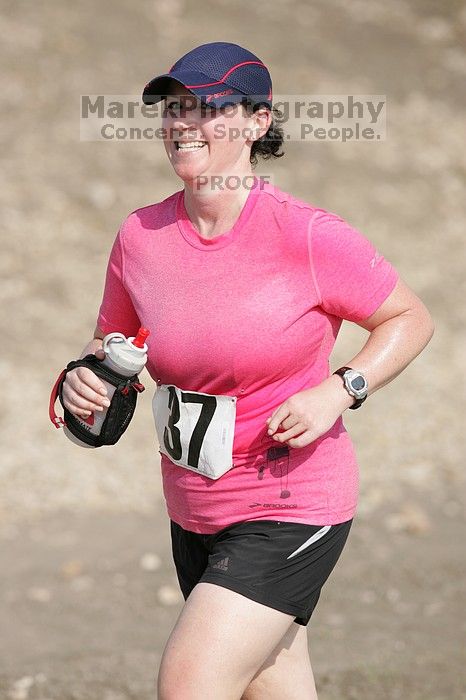 Meredith Cohen running the Army Dillo half-marathon and 32K race.

Filename: SRM_20080921_1001065.jpg
Aperture: f/4.0
Shutter Speed: 1/2000
Body: Canon EOS-1D Mark II
Lens: Canon EF 300mm f/2.8 L IS