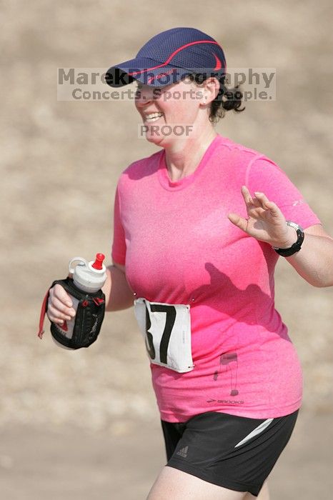 Meredith Cohen running the Army Dillo half-marathon and 32K race.

Filename: SRM_20080921_1001080.jpg
Aperture: f/4.0
Shutter Speed: 1/2000
Body: Canon EOS-1D Mark II
Lens: Canon EF 300mm f/2.8 L IS