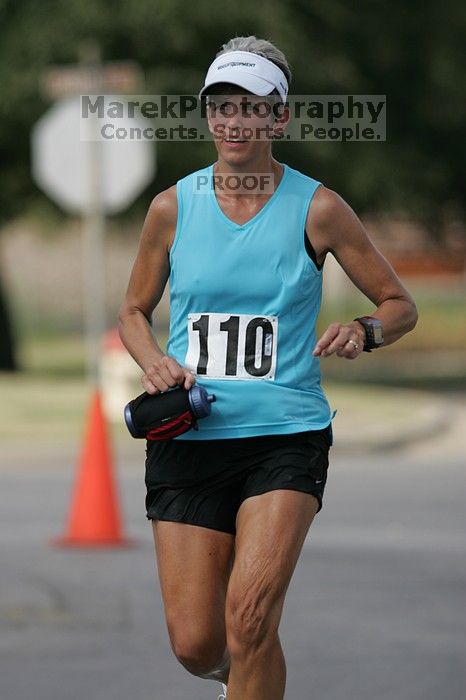 Karen Pearce placed second in her age groun at the Army Dillo half-marathon and 32K race.

Filename: SRM_20080921_1056446.jpg
Aperture: f/4.0
Shutter Speed: 1/2500
Body: Canon EOS-1D Mark II
Lens: Canon EF 300mm f/2.8 L IS