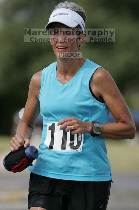 Karen Pearce placed second in her age groun at the Army Dillo half-marathon and 32K race.

Filename: SRM_20080921_1056461.jpg
Aperture: f/4.0
Shutter Speed: 1/2000
Body: Canon EOS-1D Mark II
Lens: Canon EF 300mm f/2.8 L IS