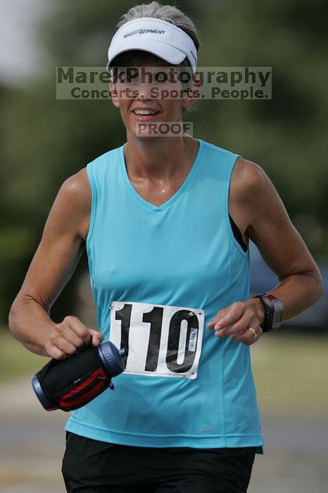 Karen Pearce placed second in her age groun at the Army Dillo half-marathon and 32K race.

Filename: SRM_20080921_1056462.jpg
Aperture: f/4.0
Shutter Speed: 1/2500
Body: Canon EOS-1D Mark II
Lens: Canon EF 300mm f/2.8 L IS