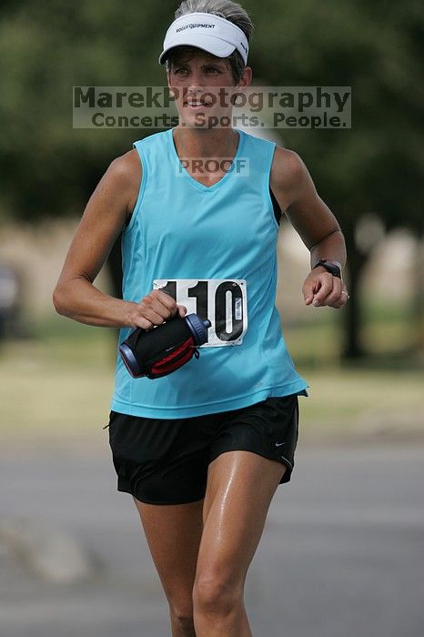 Karen Pearce placed second in her age groun at the Army Dillo half-marathon and 32K race.

Filename: SRM_20080921_1056467.jpg
Aperture: f/4.0
Shutter Speed: 1/2500
Body: Canon EOS-1D Mark II
Lens: Canon EF 300mm f/2.8 L IS