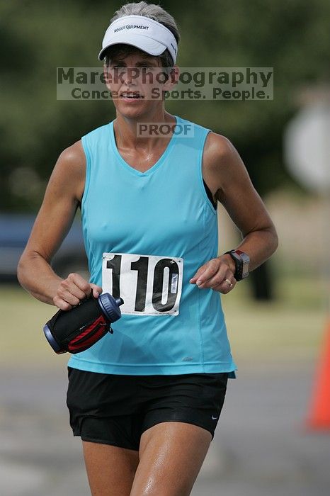 Karen Pearce placed second in her age groun at the Army Dillo half-marathon and 32K race.

Filename: SRM_20080921_1056469.jpg
Aperture: f/4.0
Shutter Speed: 1/2000
Body: Canon EOS-1D Mark II
Lens: Canon EF 300mm f/2.8 L IS