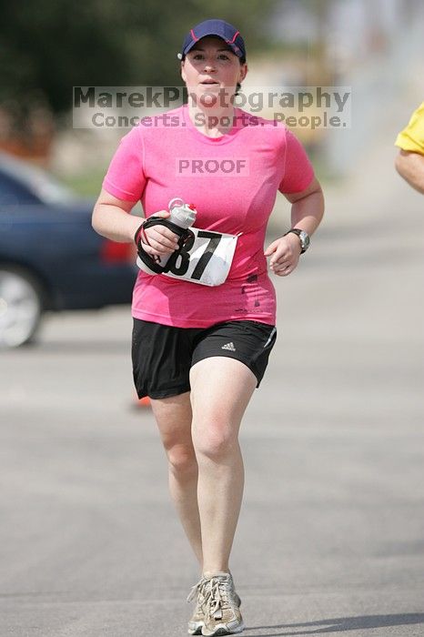 Meredith Cohen running the Army Dillo half-marathon and 32K race.

Filename: SRM_20080921_1115587.jpg
Aperture: f/4.0
Shutter Speed: 1/2000
Body: Canon EOS-1D Mark II
Lens: Canon EF 300mm f/2.8 L IS