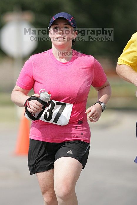 Meredith Cohen running the Army Dillo half-marathon and 32K race.

Filename: SRM_20080921_1116000.jpg
Aperture: f/4.0
Shutter Speed: 1/2000
Body: Canon EOS-1D Mark II
Lens: Canon EF 300mm f/2.8 L IS