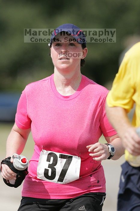 Meredith Cohen running the Army Dillo half-marathon and 32K race.

Filename: SRM_20080921_1116023.jpg
Aperture: f/4.0
Shutter Speed: 1/2000
Body: Canon EOS-1D Mark II
Lens: Canon EF 300mm f/2.8 L IS